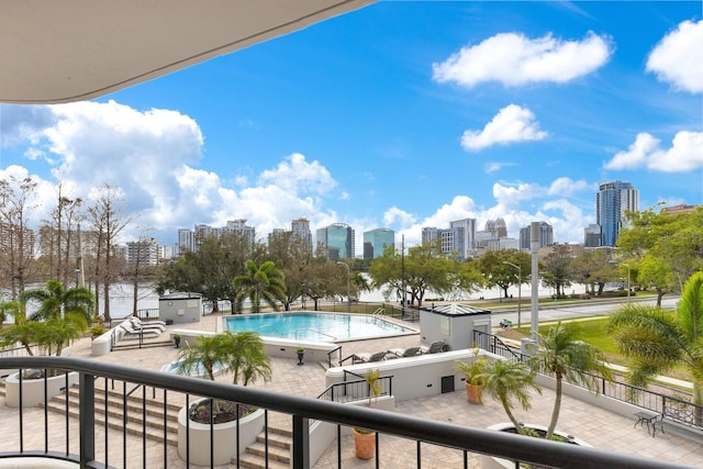 balcony with a view of city and a patio