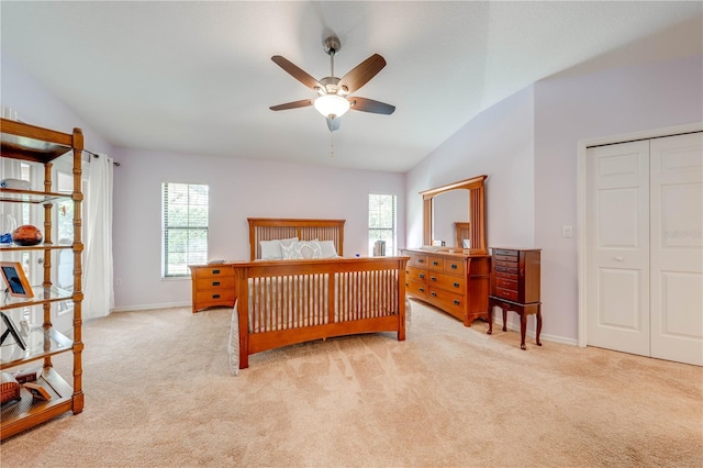 bedroom featuring baseboards, carpet flooring, and vaulted ceiling