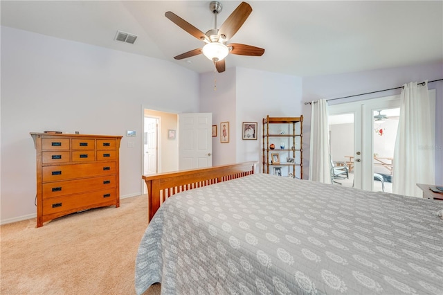 bedroom featuring visible vents, a ceiling fan, carpet, access to exterior, and vaulted ceiling