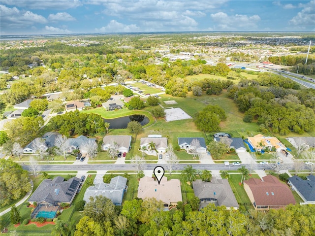 birds eye view of property with a residential view