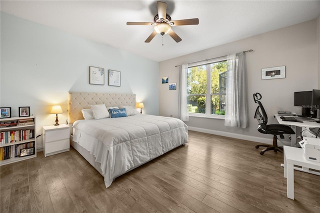 bedroom featuring hardwood / wood-style flooring, baseboards, and a ceiling fan