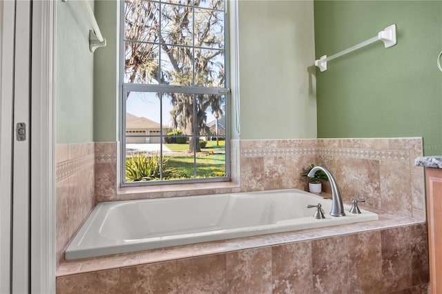 bathroom with a garden tub