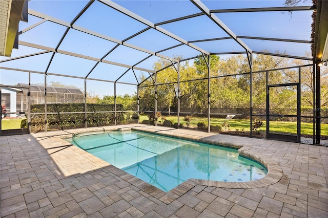 pool with glass enclosure and a patio