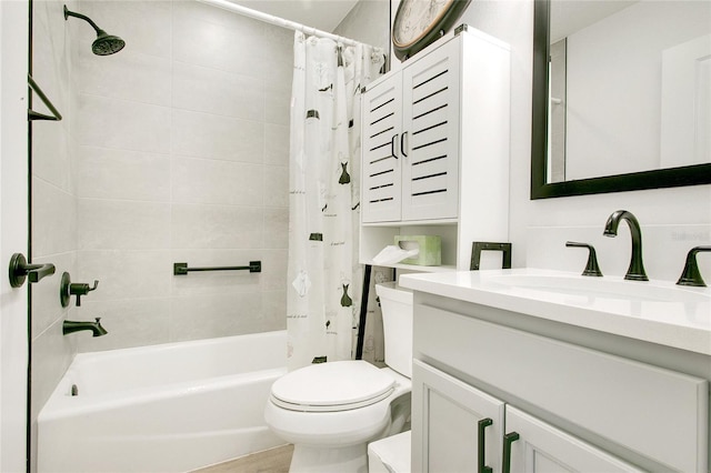 full bath with vanity, toilet, and shower / tub combo with curtain