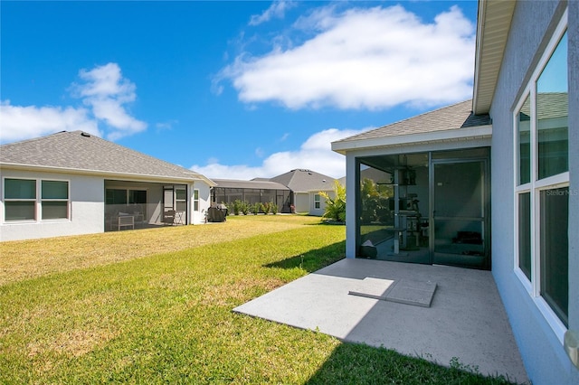 view of yard with a patio and a sunroom