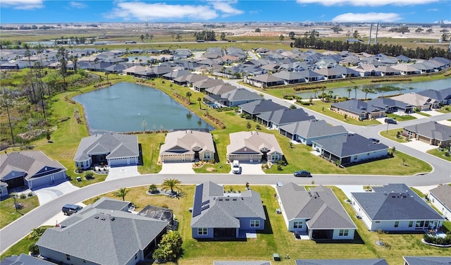 aerial view featuring a residential view and a water view