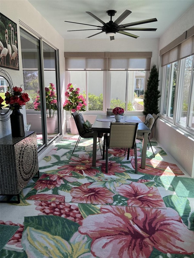 sunroom with a ceiling fan