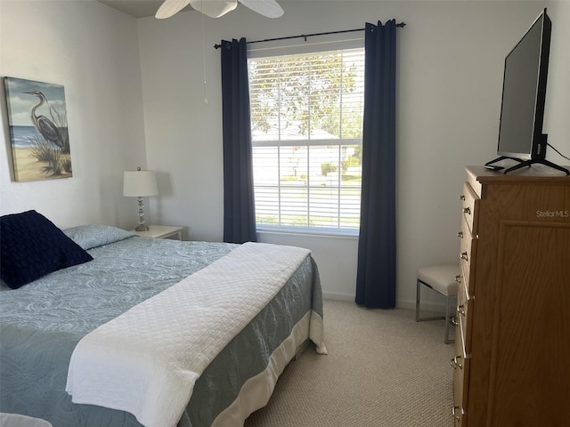 carpeted bedroom featuring baseboards