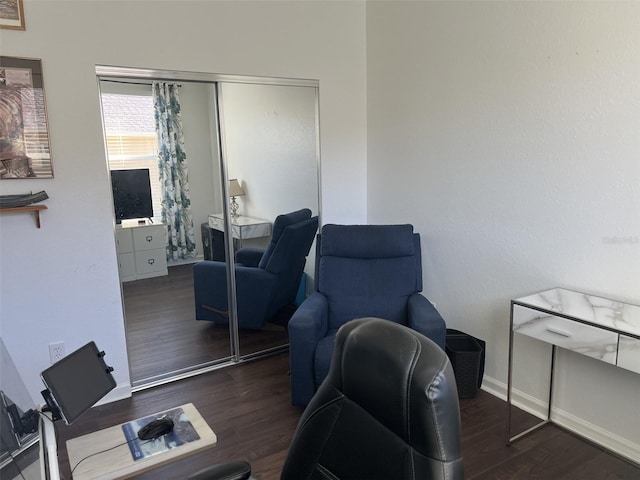 home office featuring baseboards and wood finished floors