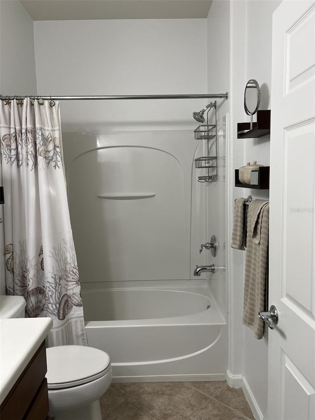 bathroom with shower / tub combo with curtain, toilet, vanity, and tile patterned flooring