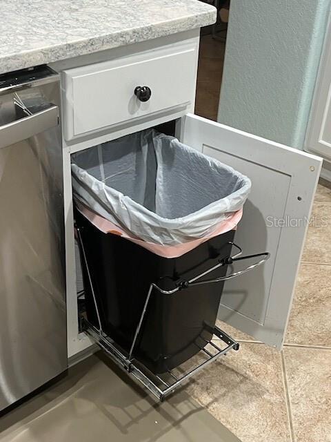 6832 SW 93rd Ave, Ocala, FL 34481 - room details with stainless steel dishwasher, white cabinets, and light countertops