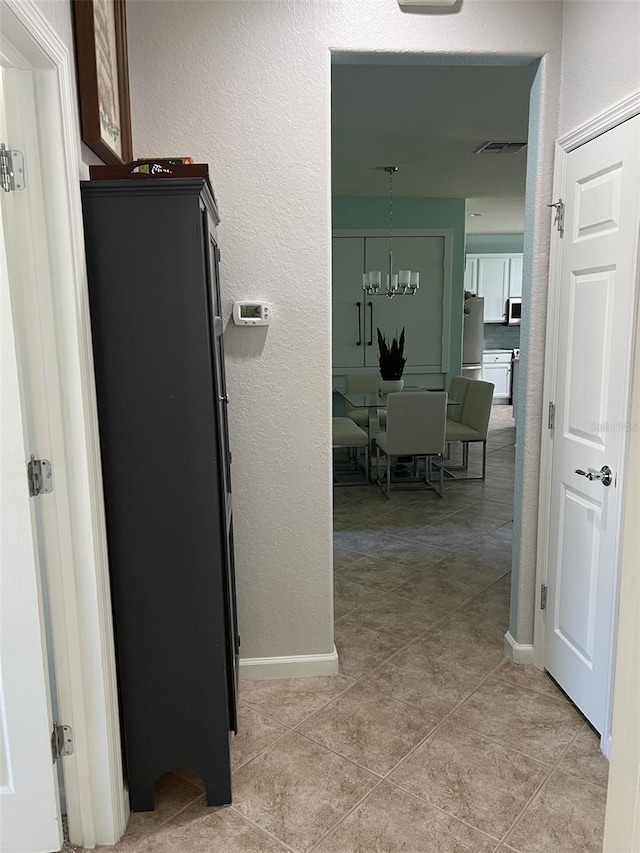 6832 SW 93rd Ave, Ocala, FL 34481 - hallway with light tile patterned floors, baseboards, and visible vents