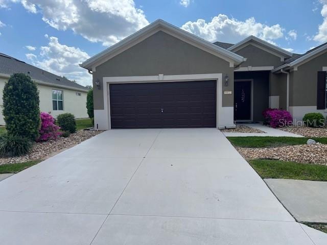 6832 SW 93rd Ave, Ocala, FL 34481 - ranch-style house featuring concrete driveway, an attached garage, and stucco siding