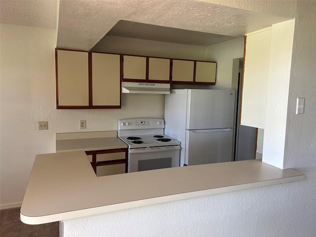 kitchen with a textured ceiling, under cabinet range hood, a peninsula, white appliances, and light countertops