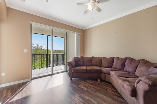 living room with dark wood-style floors, baseboards, a ceiling fan, and crown molding