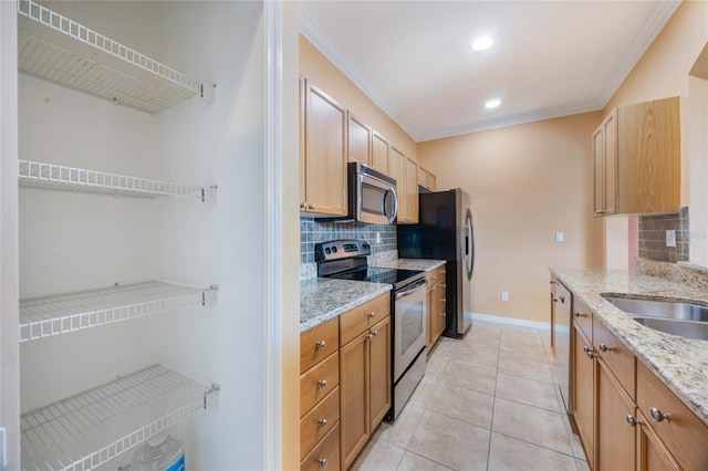 kitchen featuring light tile patterned floors, light stone counters, ornamental molding, stainless steel appliances, and backsplash