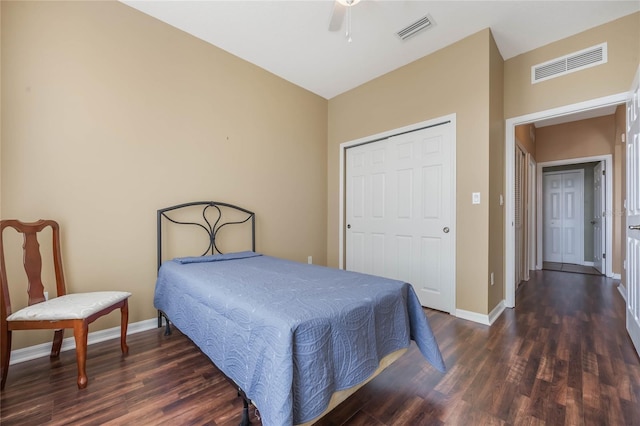 bedroom featuring visible vents, baseboards, and wood finished floors