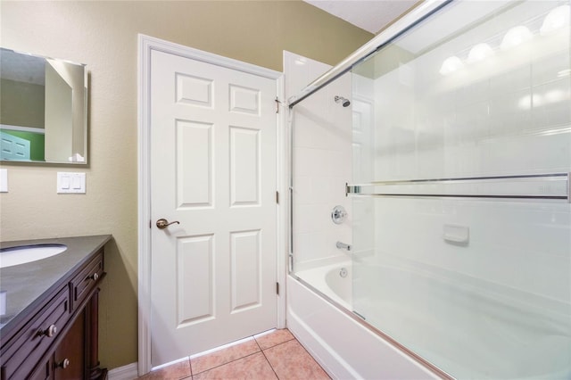 bathroom with tile patterned flooring, tub / shower combination, and vanity