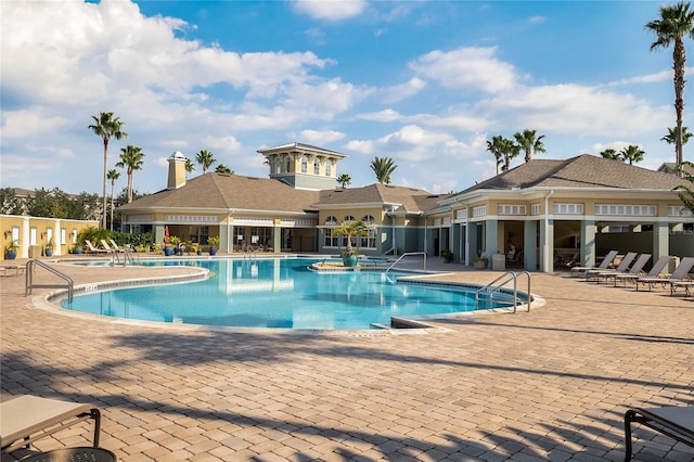 community pool featuring a patio area