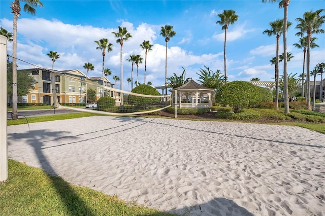 view of community with volleyball court, a gazebo, and a residential view
