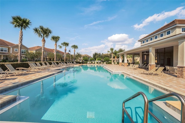 community pool with a patio area