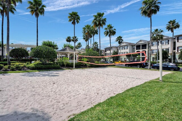 surrounding community with a gazebo, a yard, and volleyball court