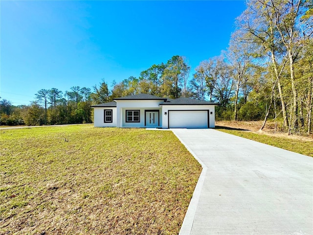 single story home with a garage, stucco siding, driveway, and a front lawn