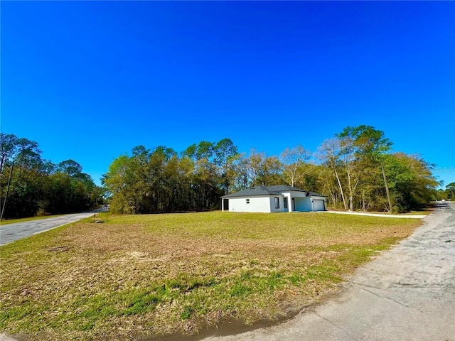 exterior space with a front lawn