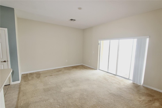 unfurnished bedroom with baseboards and light colored carpet