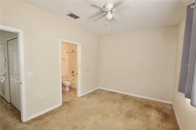 unfurnished bedroom with light carpet, ensuite bath, baseboards, and visible vents