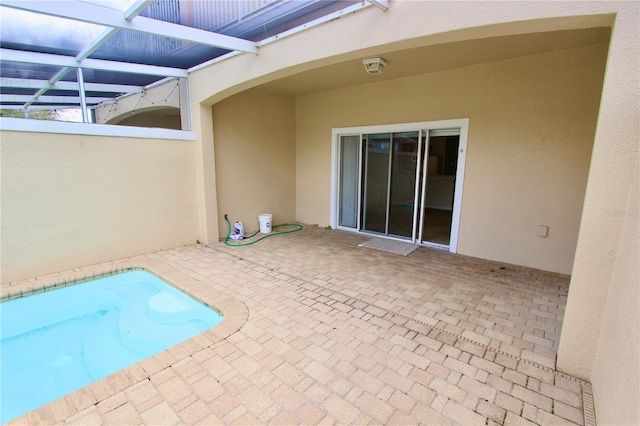 view of pool featuring a patio area and a lanai