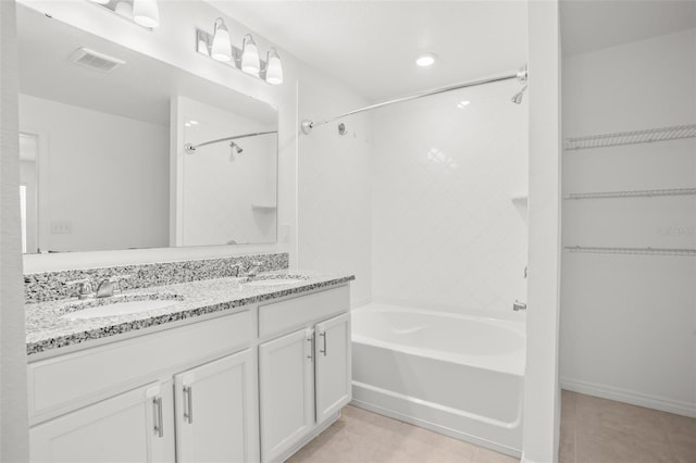 bathroom with bathtub / shower combination, visible vents, a sink, and tile patterned floors