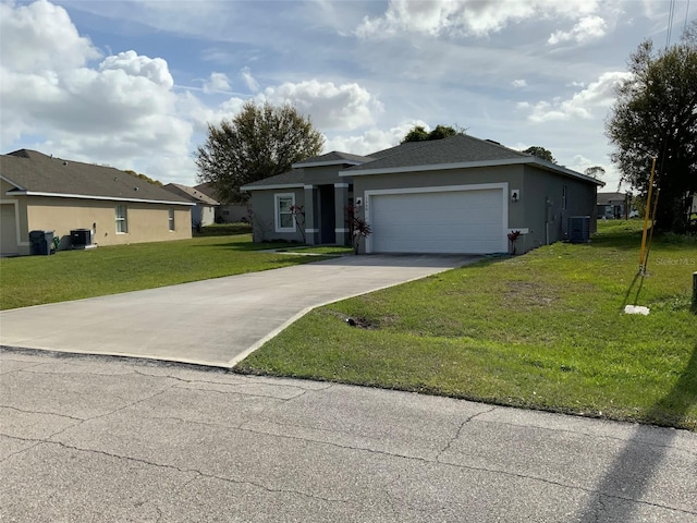 single story home with a garage, concrete driveway, a front lawn, central AC, and stucco siding