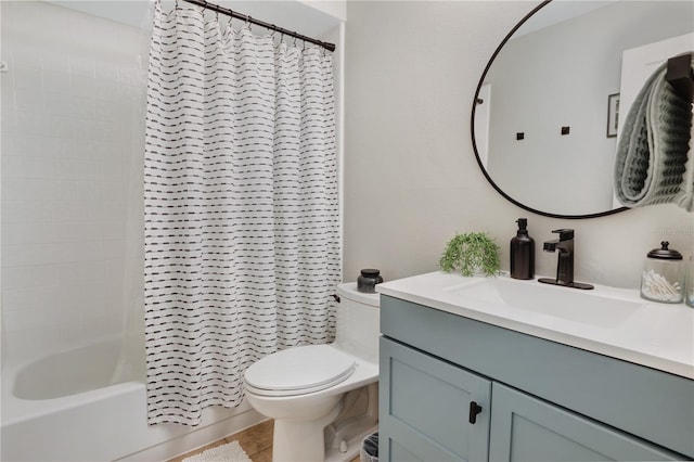 bathroom with shower / tub combo, toilet, and vanity