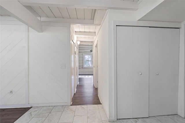 hallway featuring beamed ceiling