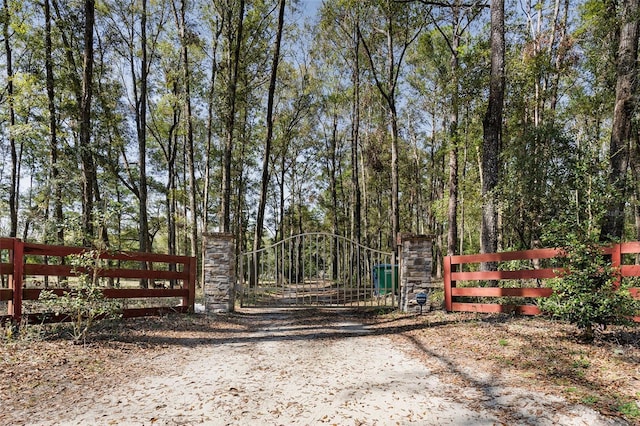 view of gate with fence