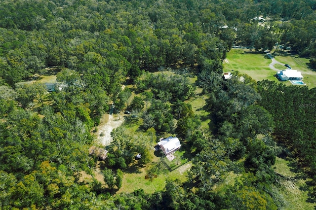 aerial view featuring a wooded view