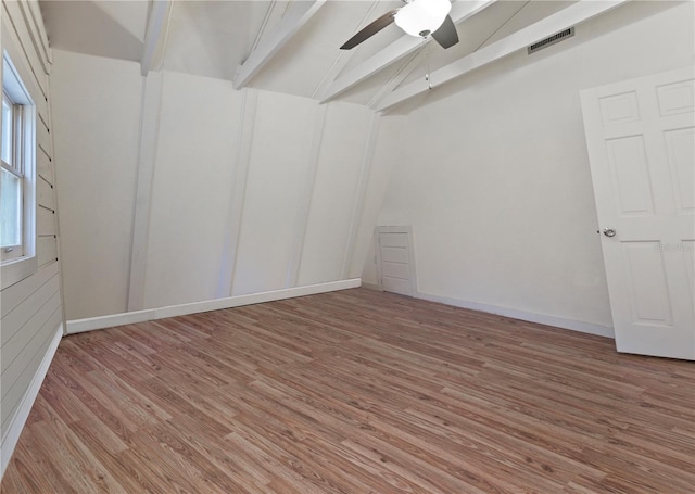 empty room featuring baseboards, visible vents, light wood-type flooring, and ceiling fan