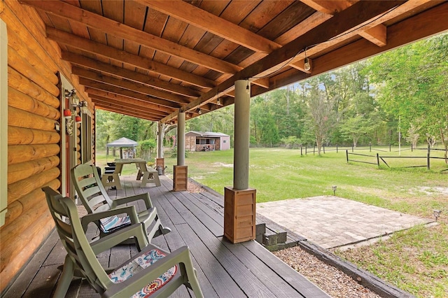 view of patio / terrace with a deck and outdoor dining area