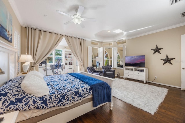 bedroom featuring visible vents, dark wood-type flooring, baseboards, and ornamental molding