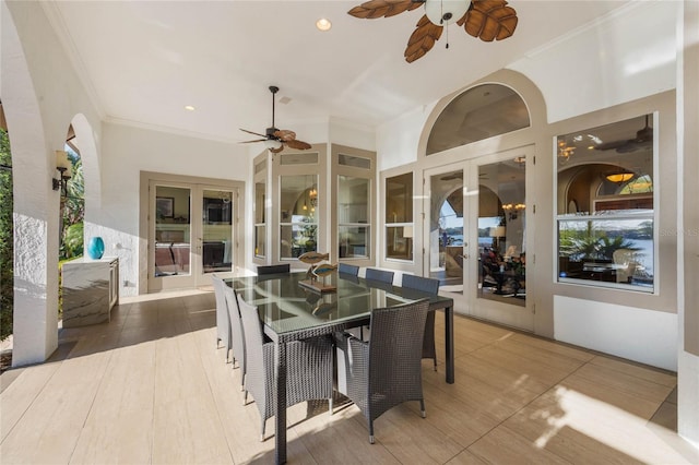 view of patio featuring french doors, outdoor dining space, and a ceiling fan