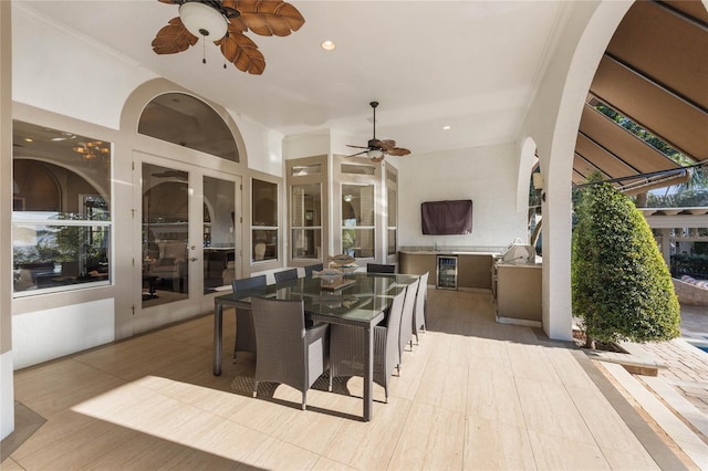 view of patio / terrace featuring area for grilling, outdoor dining space, french doors, and ceiling fan