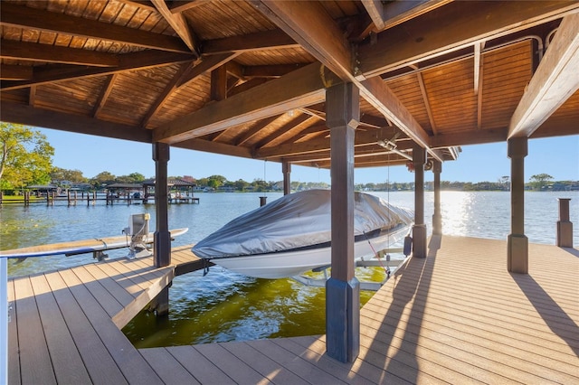 view of dock featuring a water view and boat lift