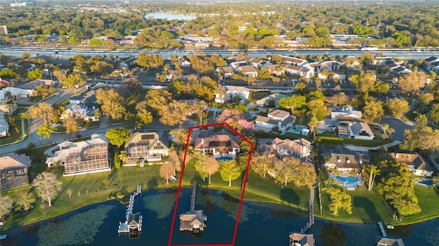 bird's eye view with a residential view and a water view