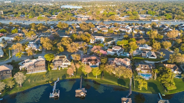 bird's eye view with a residential view and a water view