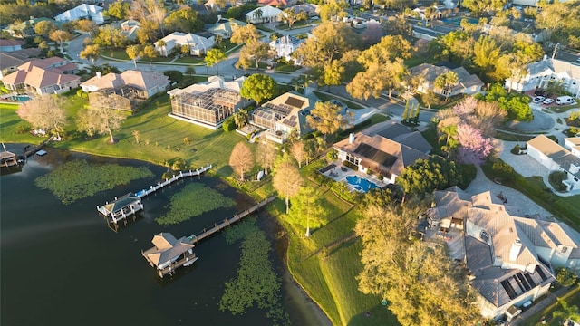 bird's eye view with a residential view and a water view