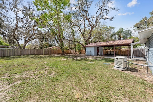 view of yard featuring an outbuilding and a fenced backyard