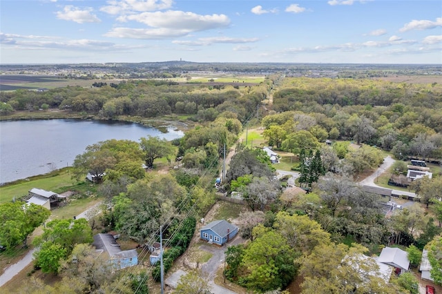 aerial view featuring a water view and a wooded view