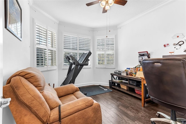 office area featuring baseboards, crown molding, ceiling fan, and wood finished floors