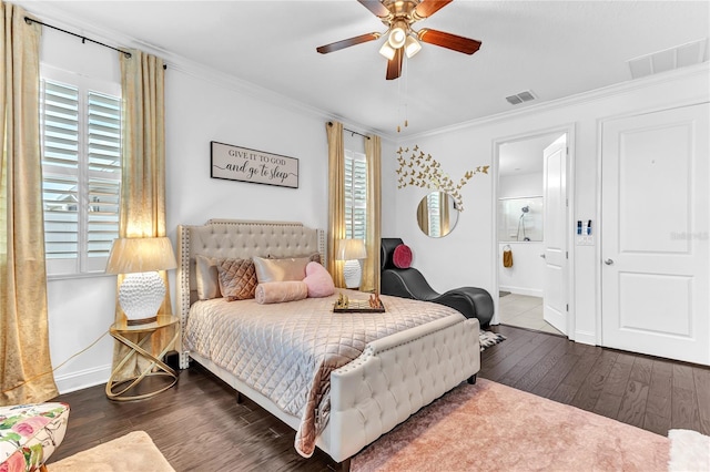 bedroom with visible vents, wood finished floors, and ornamental molding